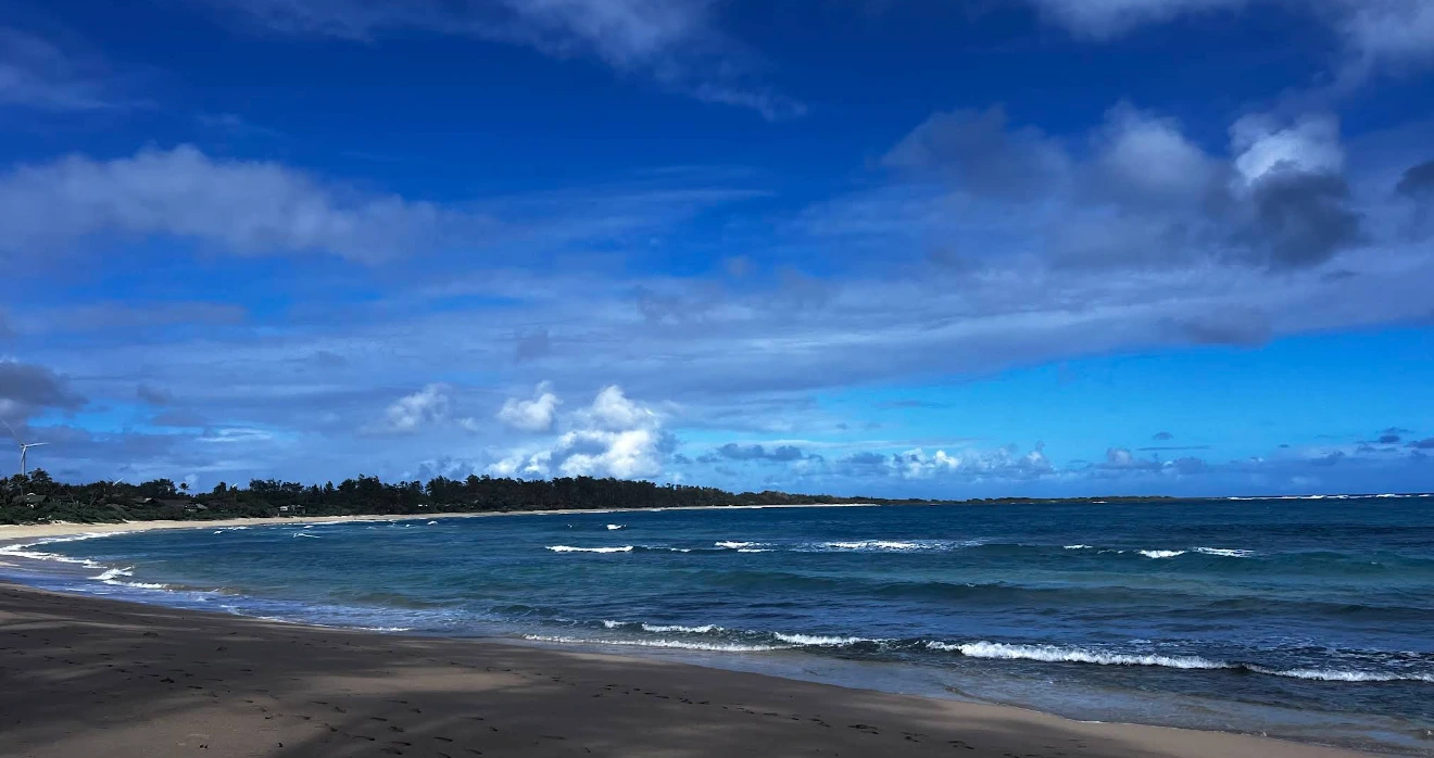 Ocean waves and blue sky at Mālaekahana State Recreation Area Oahu