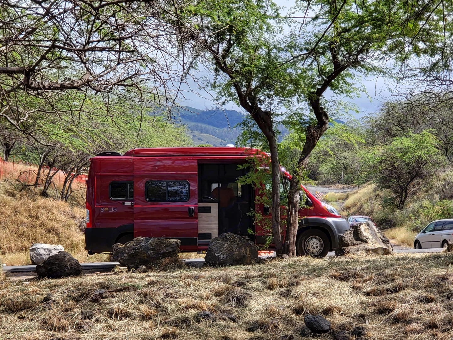 The Roamer, a 2022 Winnebago Solis Class B motorhome in Wailuku, Maui, Hawaii, with ocean views and space for larger families. This 20-foot camper sleeps up to 4 guests with two queen-size beds, accommodates up to 6 passengers, has a 5.0-star rating from 68 trips, offers delivery within 10 miles, includes unlimited mileage, does not have a generator, and is not pet-friendly.