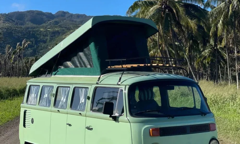 1990 Volkswagen Kombi camper van in Wahiawa, Hawaii. This 14-foot camper van sleeps up to 4 guests with two full-size beds, accommodates 4 passengers, does not have a generator, and is not pet-friendly.