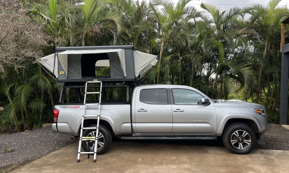 2016 Toyota Tacoma Long Bed Double Cab camper in Lihue, Hawaii. This 20-foot camper sleeps 2 guests in a full-size bed, has a 5.0-star rating from 2 reviews, offers delivery within 5 miles, includes unlimited mileage, and is not pet-friendly.