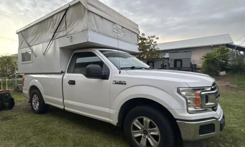 2019 Ford F-150 Rural Camper in Hilo, Hawaii. This 19-foot truck camper sleeps up to 3 guests with one queen-size bed and one twin bed, has a 5.0-star rating from 4 reviews, offers unlimited mileage, includes unlimited generator hours, and is not pet-friendly.
