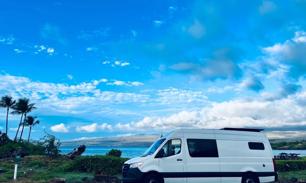 Aloha Living camper van in Kalaoa, Hawaii. This 22-foot camper van sleeps up to 3 guests with one queen-size bed and one twin bed, accommodates up to 4 passengers, has a 5.0-star rating from 35 reviews, offers delivery within 20 miles, includes 100 free miles per day, does not have a generator, and is not pet-friendly.