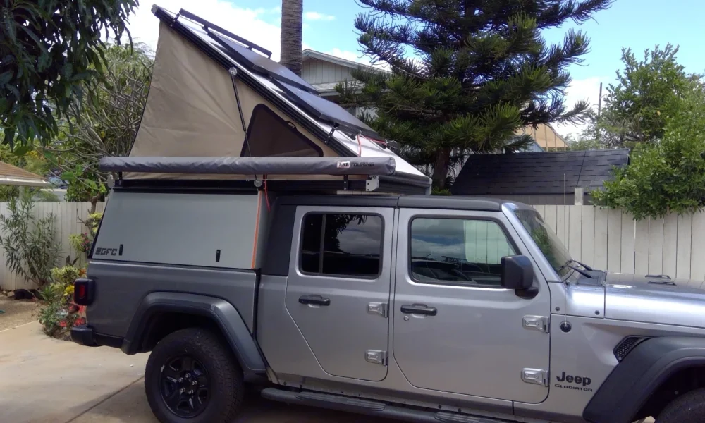 Explorer truck camper in Kihei, Maui, Hawaii. This 18-foot camper sleeps 2 guests, accommodates up to 4 passengers, has a 4.9-star rating from 48 trips, offers unlimited mileage, includes unlimited generator hours, and is not pet-friendly.