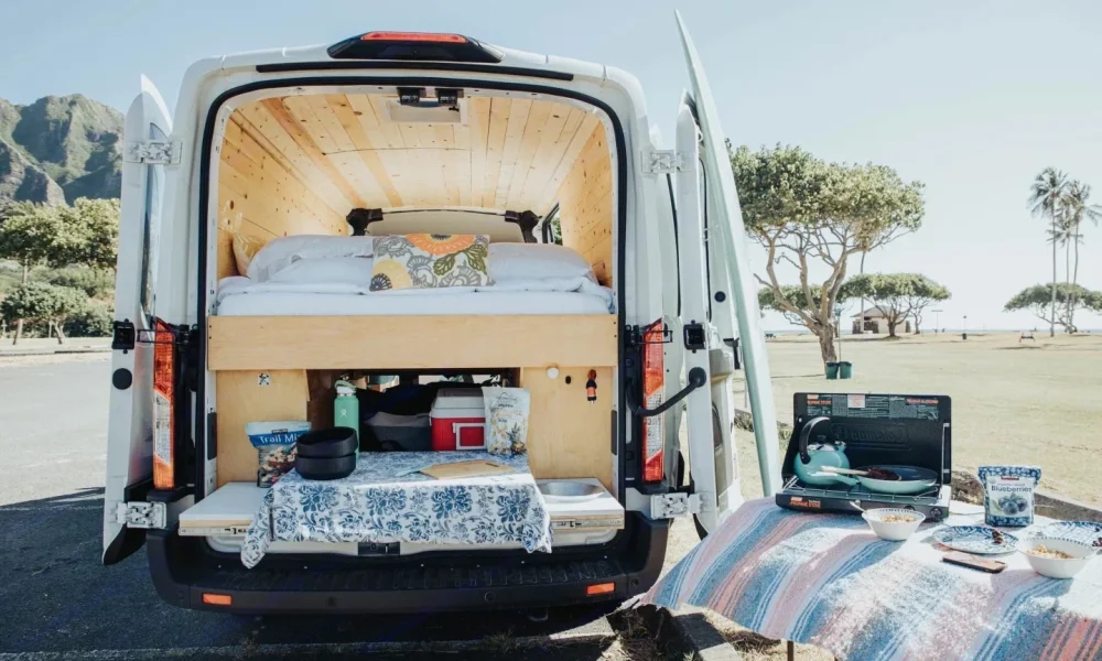North Shore Adventure Camper Van in Honolulu, Hawaii. This 20-foot camper van sleeps 2 guests with a queen-size bed, has a 4.3-star rating from 21 trips, is pet-friendly, offers unlimited mileage, and does not have a generator.