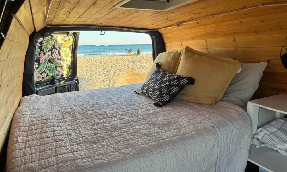 Sunset Seeker camper van in Ewa Beach, Hawaii. This 19-foot camper van sleeps 2 guests with a queen-size bed, has a 5.0-star rating from 1 trip, is pet-friendly, offers delivery within 25 miles, includes 100 free miles per day, and does not have a generator.
