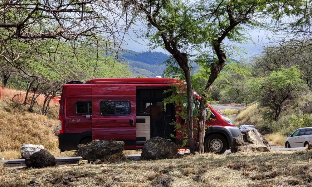 The Roamer, a 2022 Winnebago Solis Class B motorhome in Wailuku, Maui, Hawaii, with ocean views and space for larger families. This 20-foot camper sleeps up to 4 guests with two queen-size beds, accommodates up to 6 passengers, has a 5.0-star rating from 68 trips, offers delivery within 10 miles, includes unlimited mileage, does not have a generator, and is not pet-friendly.